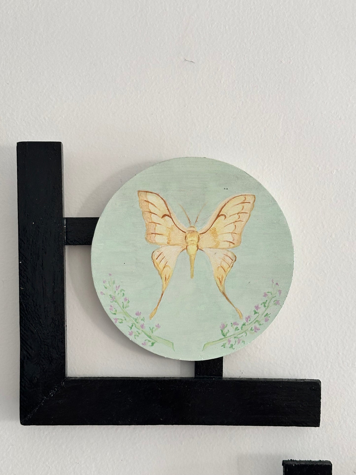 Set of 3 Floral wall hangings: Flat and Embossed Paintings on round MDF boards with black wooden L-shaped frames.