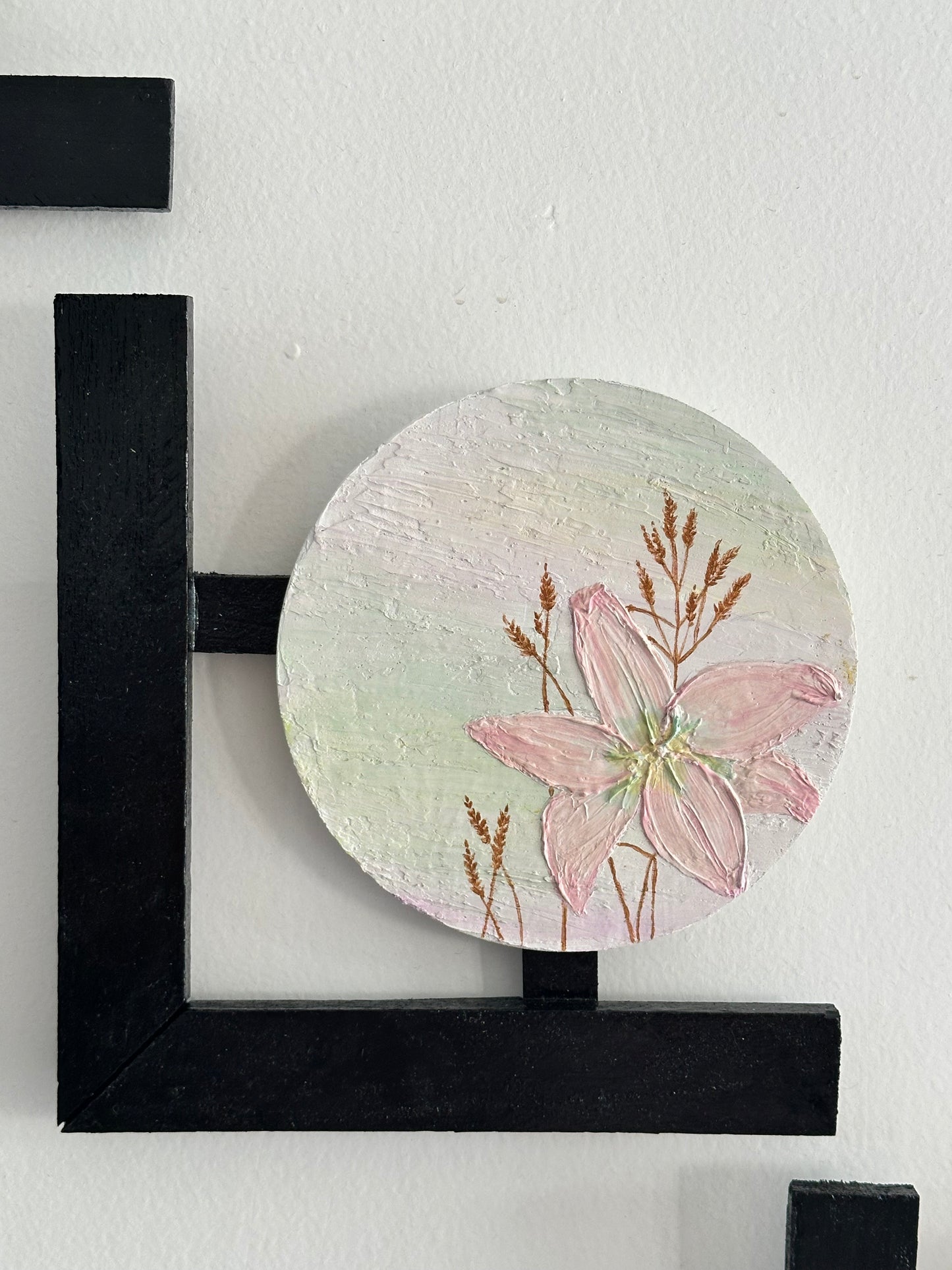 Set of 3 Floral wall hangings: Flat and Embossed Paintings on round MDF boards with black wooden L-shaped frames.