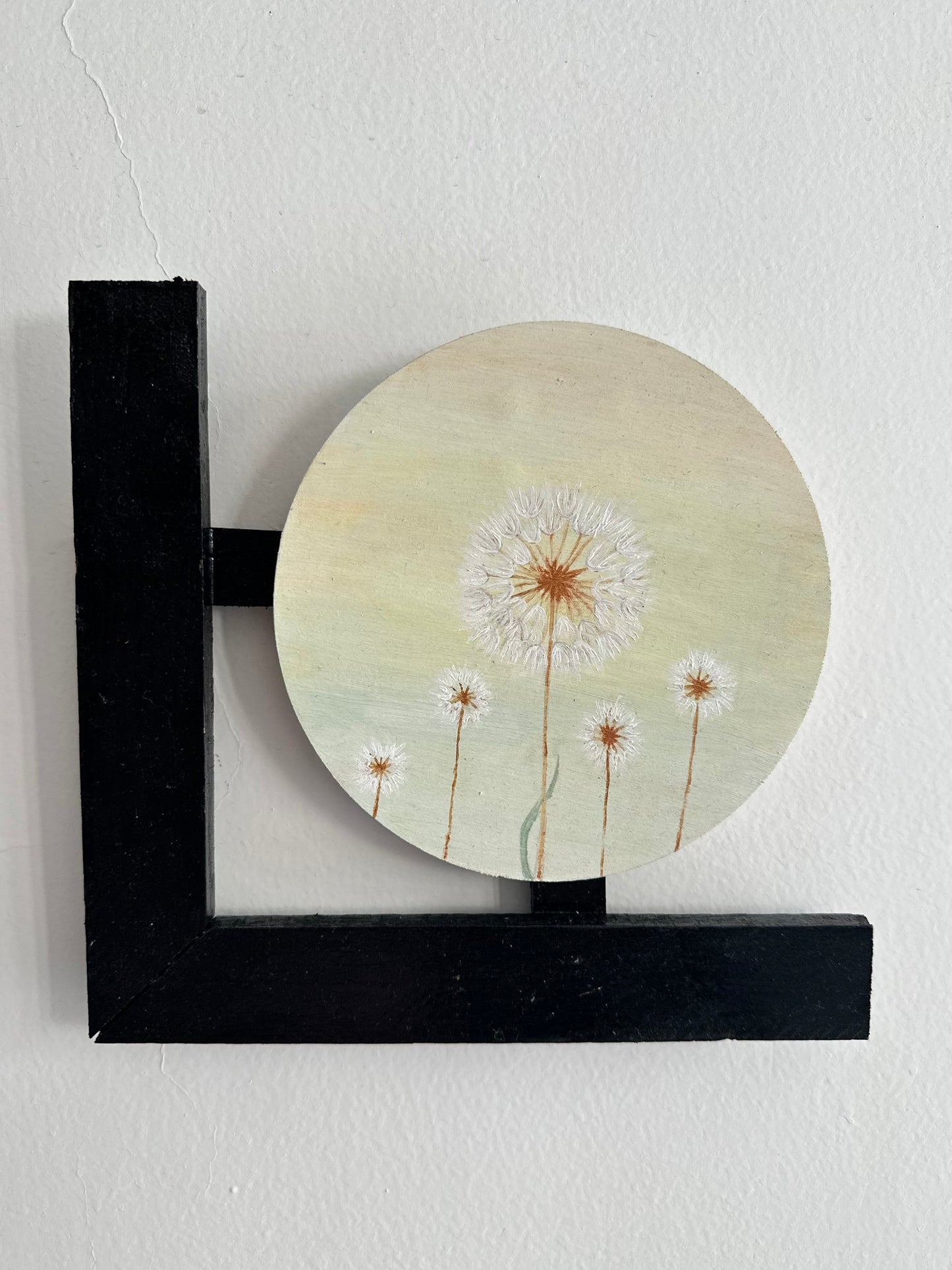 Set of 3 Floral wall hangings: Flat and Embossed Paintings on round MDF boards with black wooden L-shaped frames.