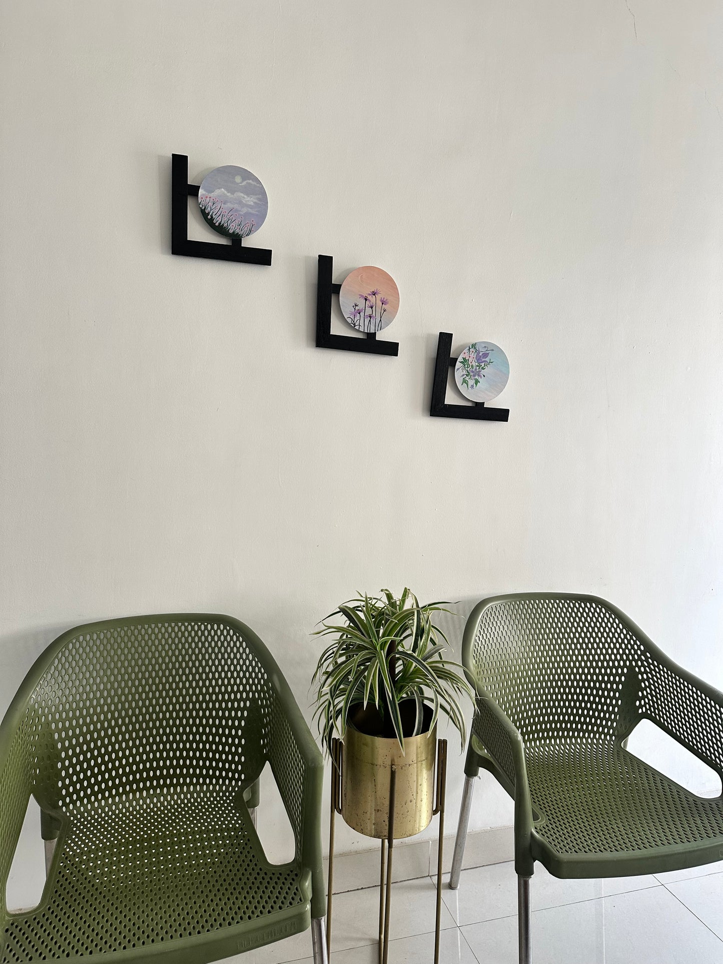 Wall hangings - set of 3 | Round Floral paintings with L-shaped black wooden frames.