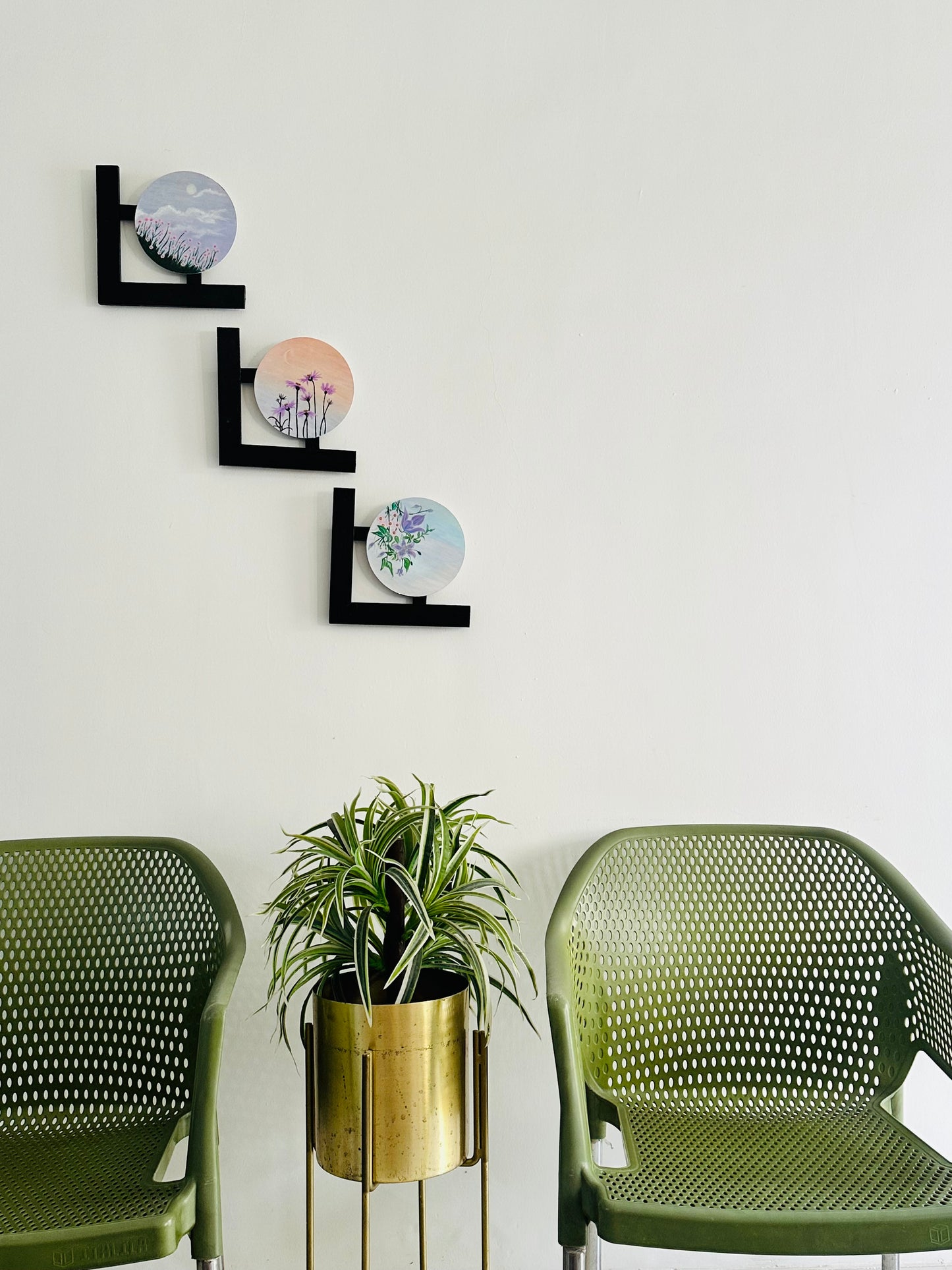 Wall hangings - set of 3 | Round Floral paintings with L-shaped black wooden frames.